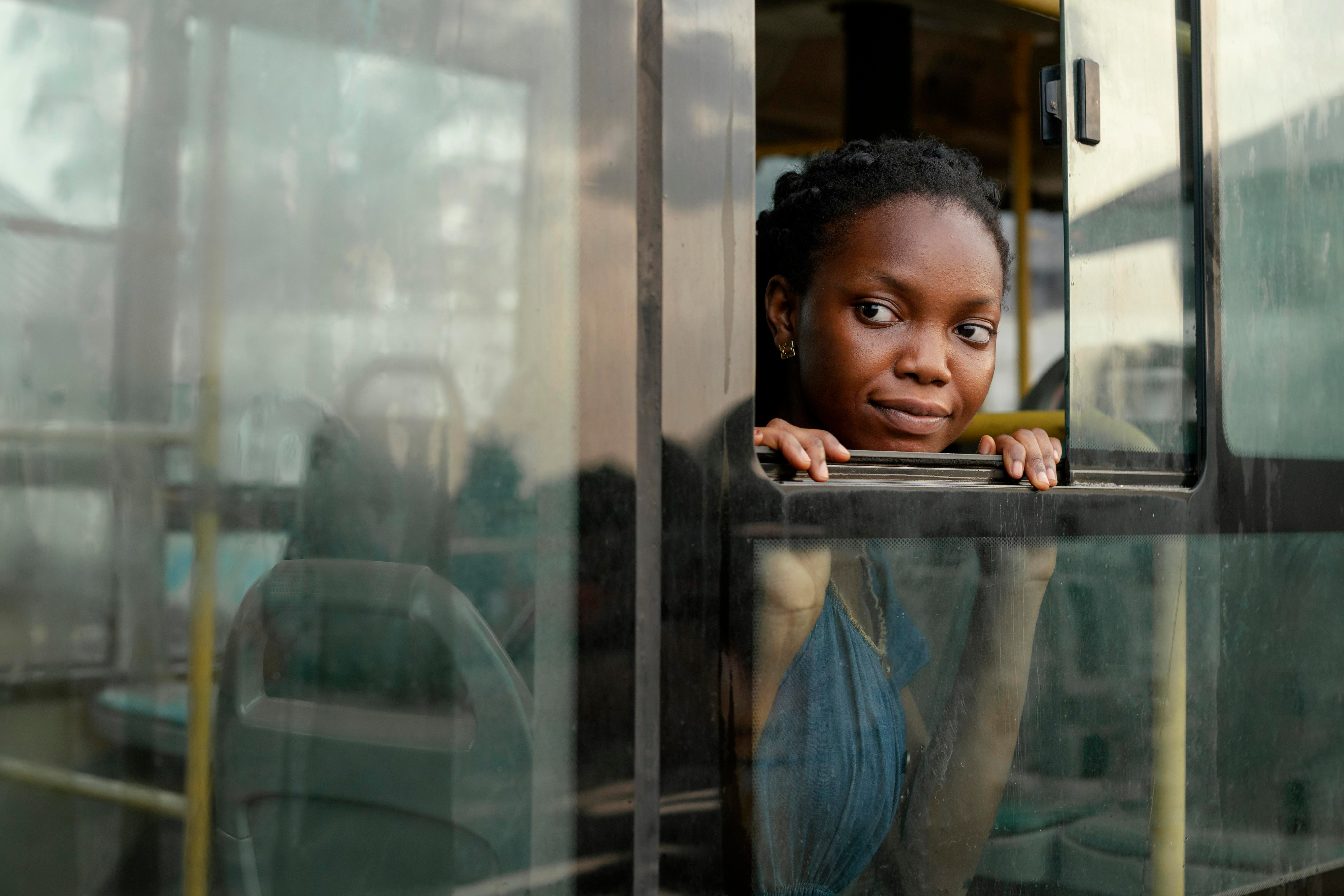 Person looking through window